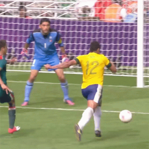 two soccer players chase after the ball, while the other player tries to stop