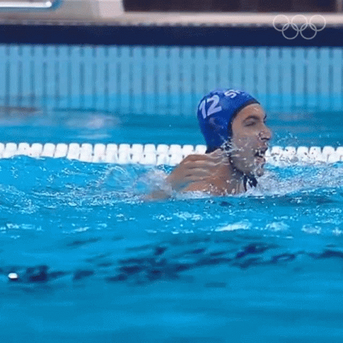 a swimmer about to swim out of the pool