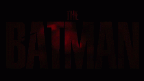 the batman logo appears on a dark background