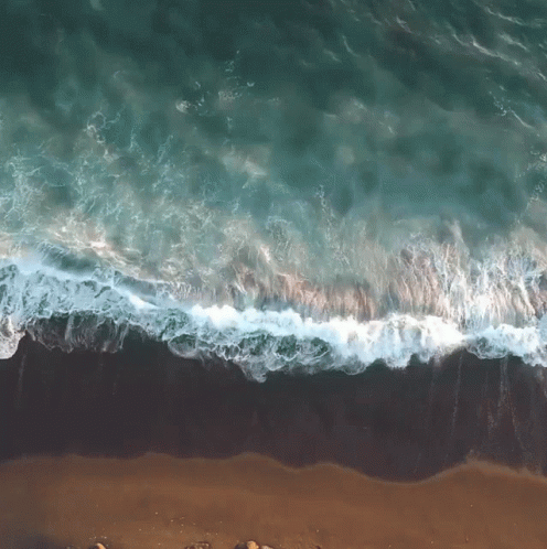 this aerial image shows some water, land and waves