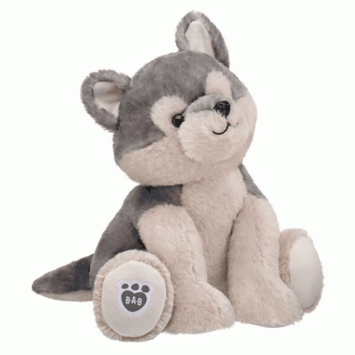 a stuffed grey animal sitting on a white background