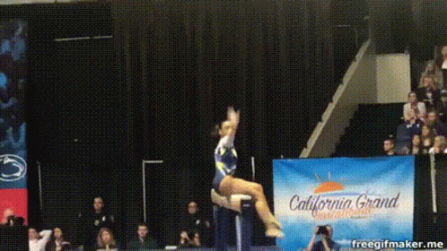 a woman is performing a stunt on a stool