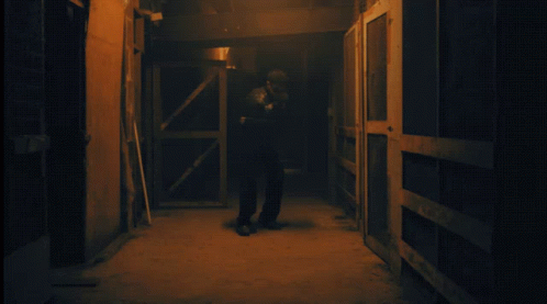 two men are standing in the dark doorways