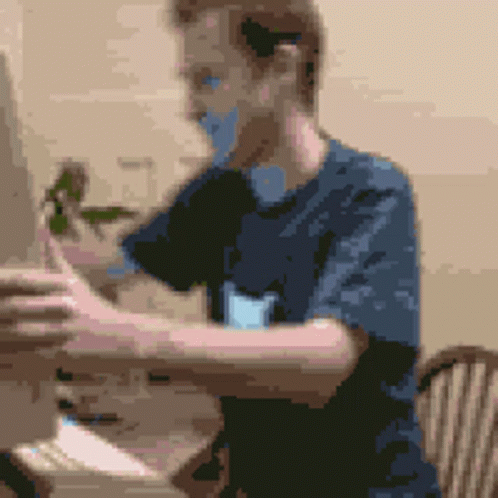 a man using a computer in his living room