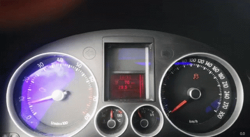 dashboard gauges displayed at different times on a car