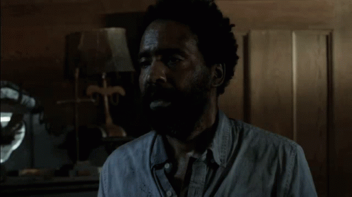 the walking dead staff has a shocked look on his face