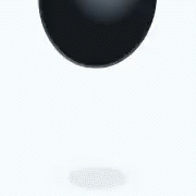 a black ball on a white background with a gray spot below