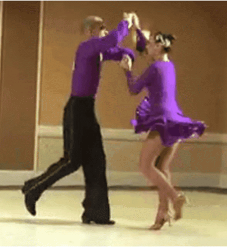 two dancers in pink and black clothing dancing
