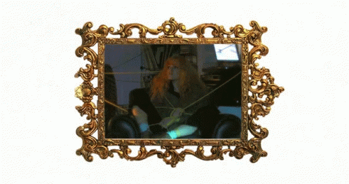 an image of a woman in a mirror