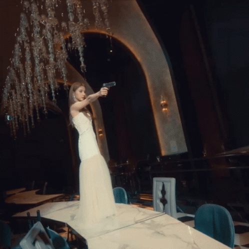 a white woman in a wedding dress at a banquet