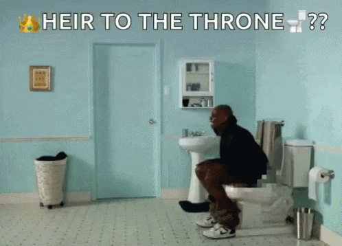 a man sitting on the toilet in his bathroom