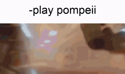 a blurry image of a black object with a text that reads play pompeii