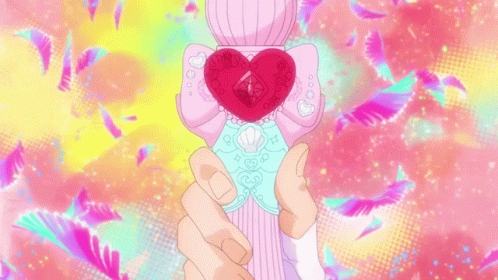 a heart shaped object with arms outstretched in front of a multicolored background