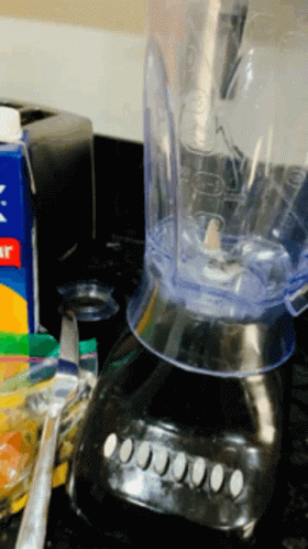 a blender filled with liquid on top of a counter