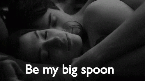 man and woman in bed with the caption be my big spoon