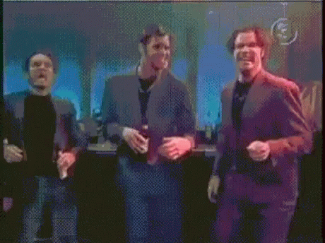 three men talking on the set of friends