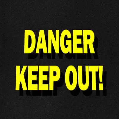 the word danger keep out in green glowing letters