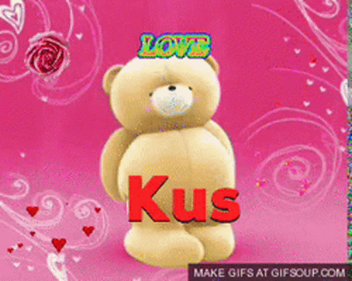 the purple bear is holding up the name kus