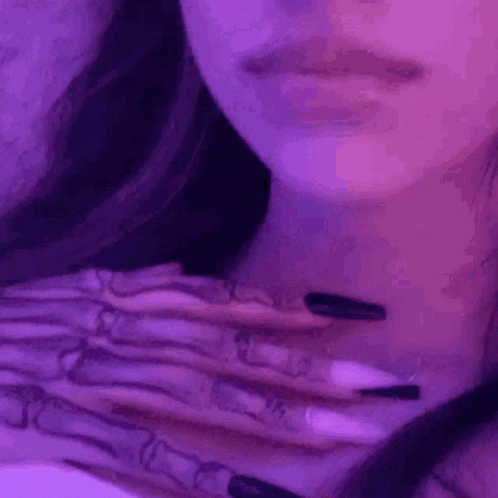 woman's hands with tattoos, in color pograph