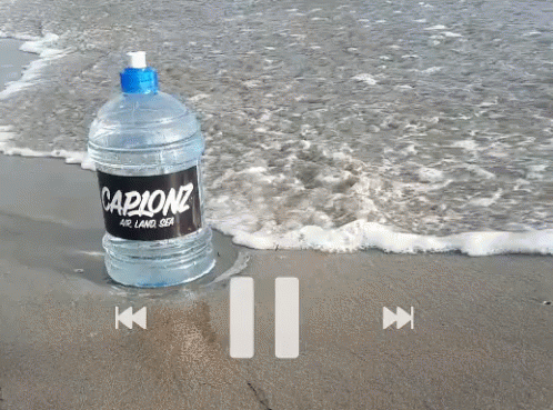 a bottle on the beach that says parscono on it