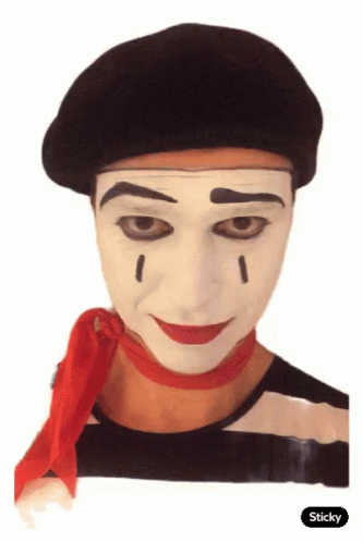 an old picture of a man wearing clown makeup