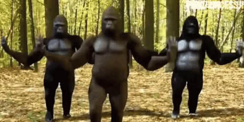 three sumo wrestlers are in a dark forest