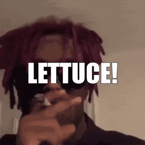 a man smoking while holding a cigarette with the words lettuce on it