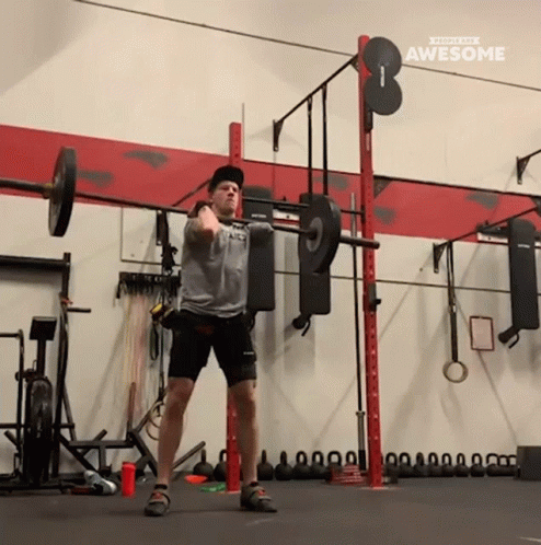 a person doing an overhead squat exercise
