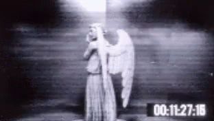 a creepy old picture of a ghost being led by an angel