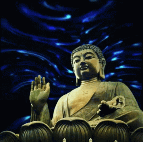 a large buddha statue standing in front of other small statues