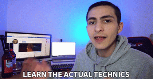 a man wearing a hoodie next to a computer screen with the words learn the actual mechanics