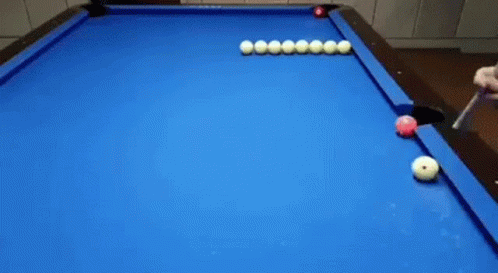 three pool balls are lying on a black pool table