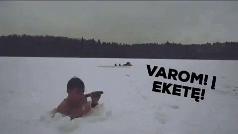 a person sledding down a hill covered in snow
