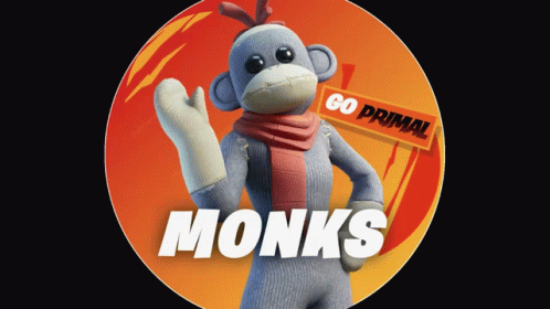 a monkey with scarf and hat holding the word monks