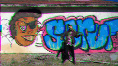 a person is standing in front of graffiti