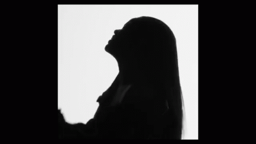 silhouette of a woman talking on the phone