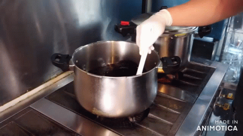 someone is stirring the batter into a large saucepan