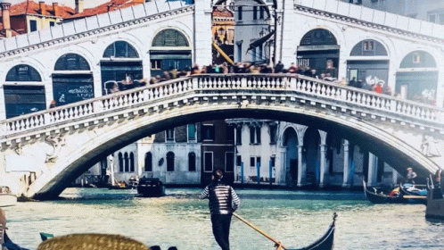 some people riding a gondola in the water