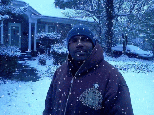 a man that is standing in the snow