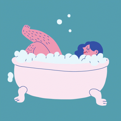 a woman taking a bath with an enormous cat