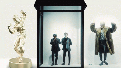 the shadow box is a display case containing two statues