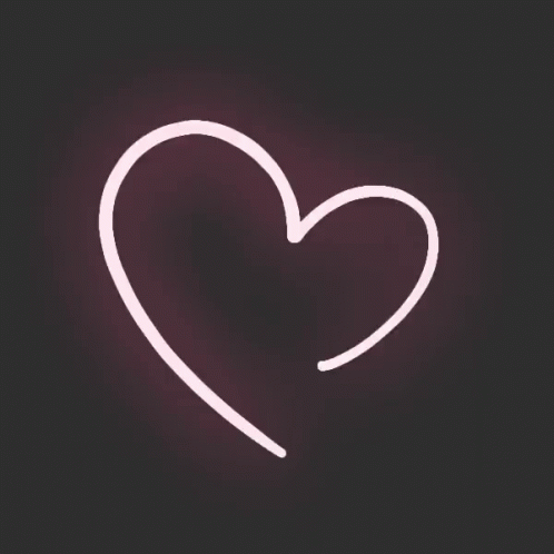 a heart shaped neon light on a black background