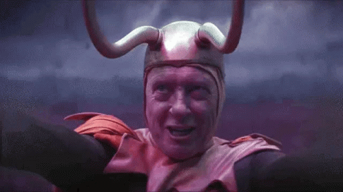 a man with purple skin wearing a helmet and horns