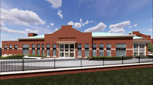a rendering of a school building with a fence around it