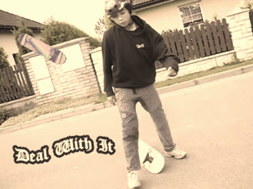 a young person in a black hoodie and checkered pants holding a skateboard