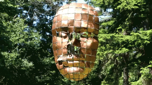a large head has a mosaic pattern on it