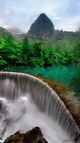 the painting has a waterfall with a lush green landscape