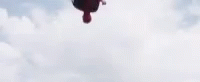 a person jumping in the air from an airplane