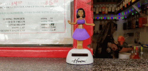 a little figurine standing on top of a counter