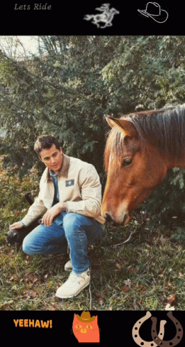 a man sitting next to a horse in a field